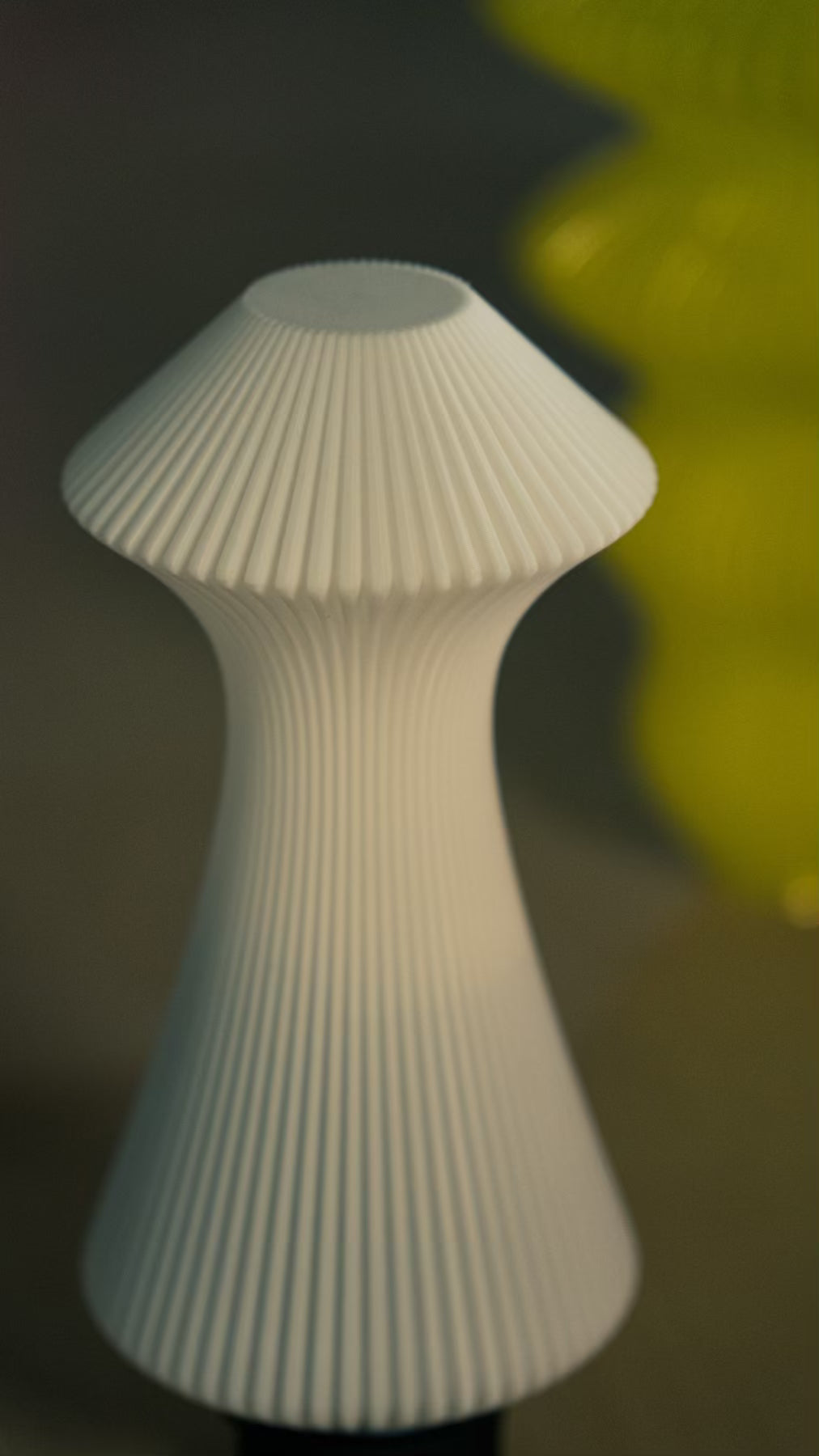 Muvèlo Volara White portable ambient table lamp displayed as sculptural decorative lighting.