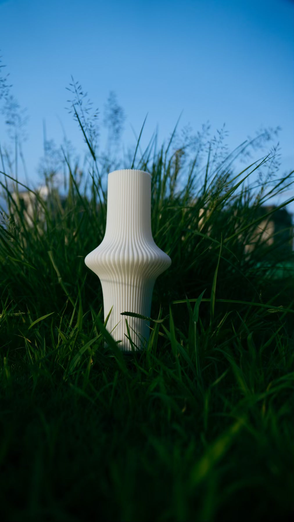 Muvèlo Zeya White portable ambient table lamp displayed as sculptural decorative lighting.