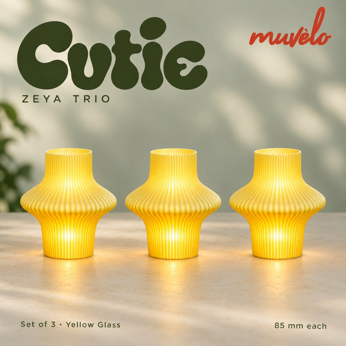 Muvèlo Cutie set of three in Yellow Glass: Zeya, Zeya, Zeya, all illuminated and shown together.