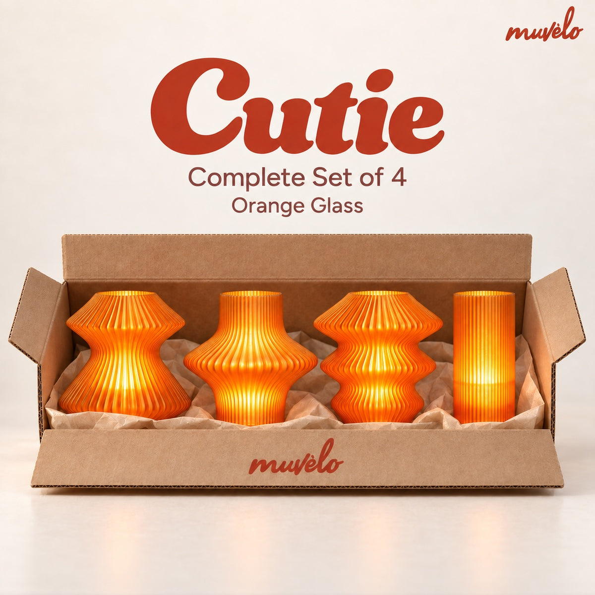All four Cutie mini lamps in Orange Glass, shown together in their box.