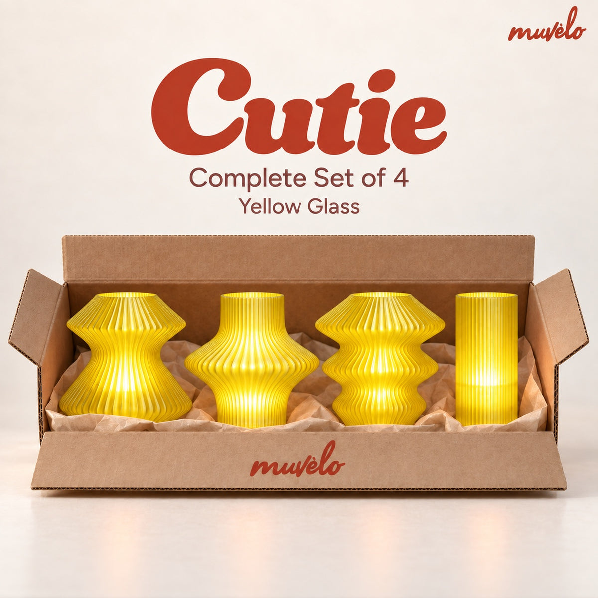 All four Cutie mini lamps in Yellow Glass, shown together in their box.