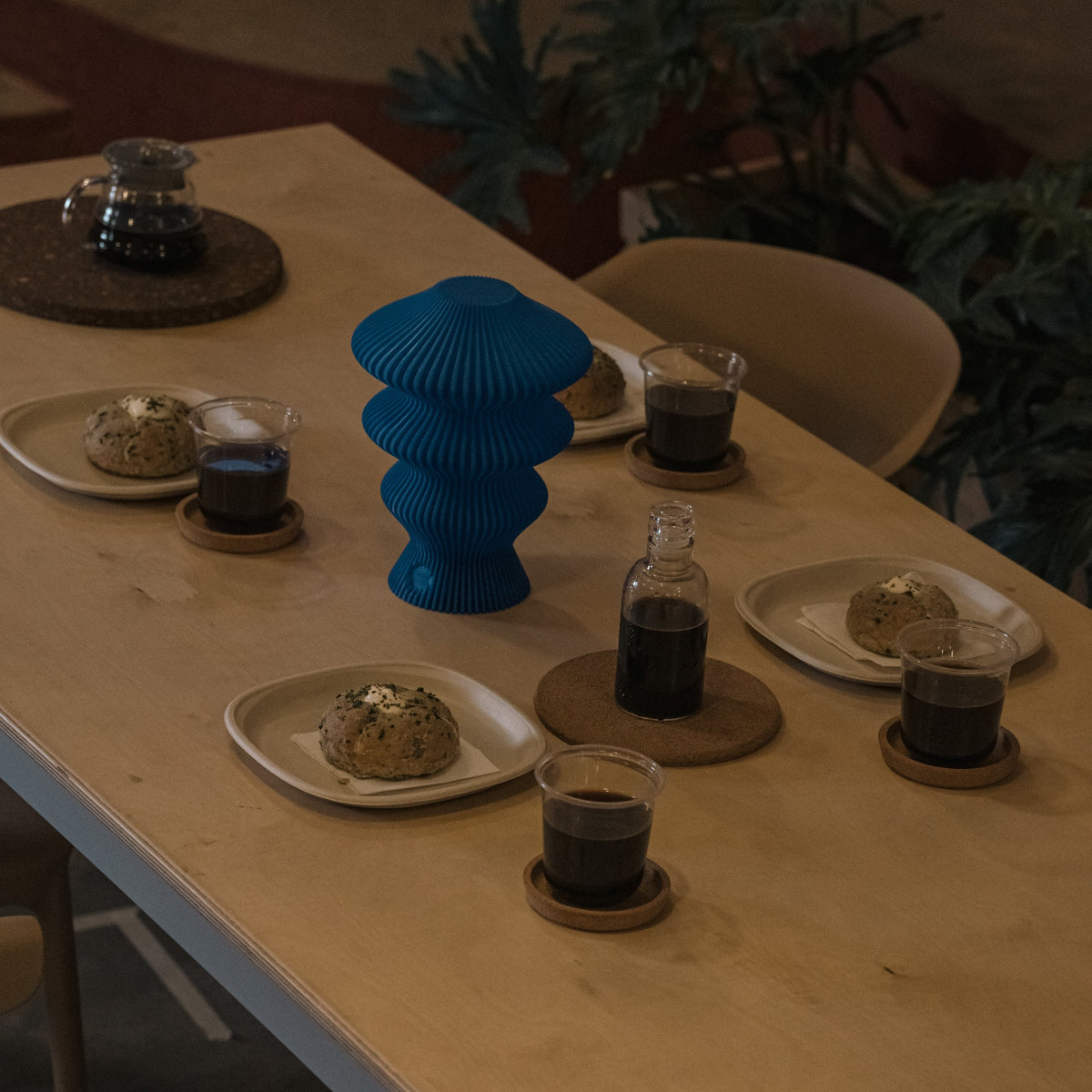 Blue Ruvaa Mono portable table lamp switched off on a dining table