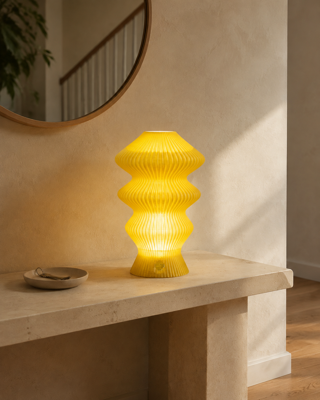 Yellow Muvèlo Ruvaa Mono glowing on an entryway console beside a key tray