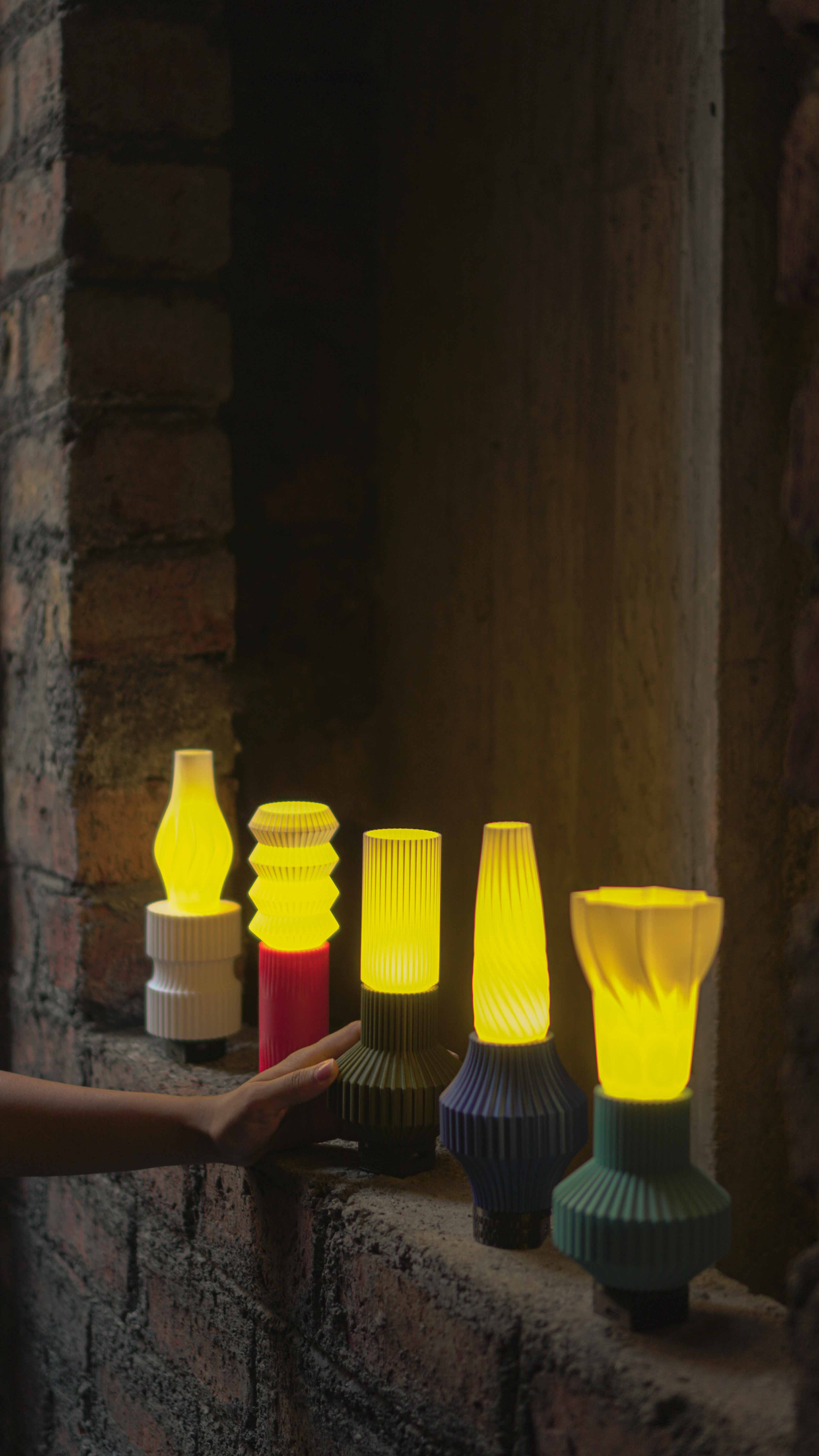 All Vaari Lights in a Line with a womans hand holding onto one