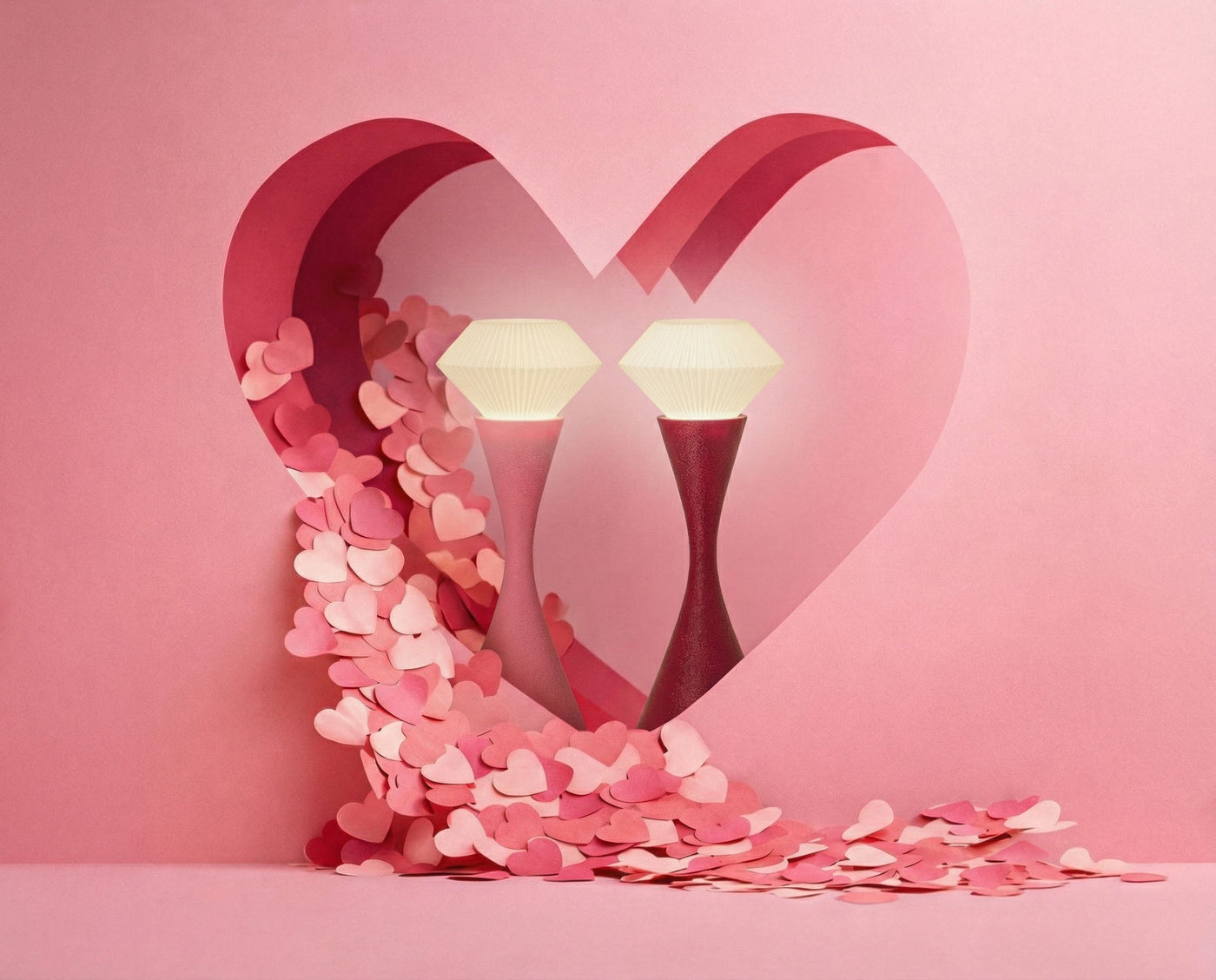 Heart-shaped arch made of pink hearts with two diamond-shaped lights on a pink background