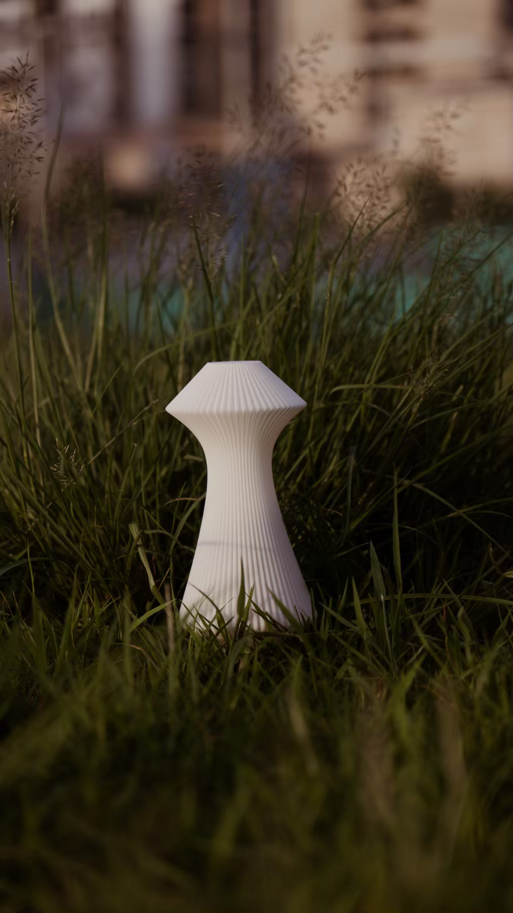 Muvèlo Volara White portable rechargeable table lamp with a sculptural ribbed form.