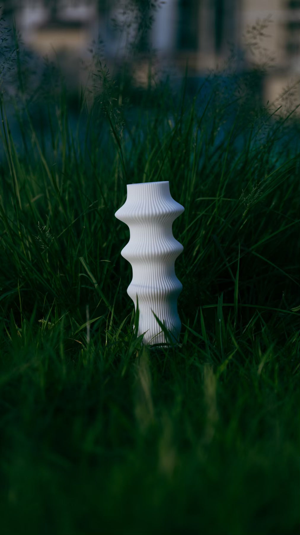 Muvèlo Ruvaa White portable rechargeable table lamp with a sculptural ribbed form.