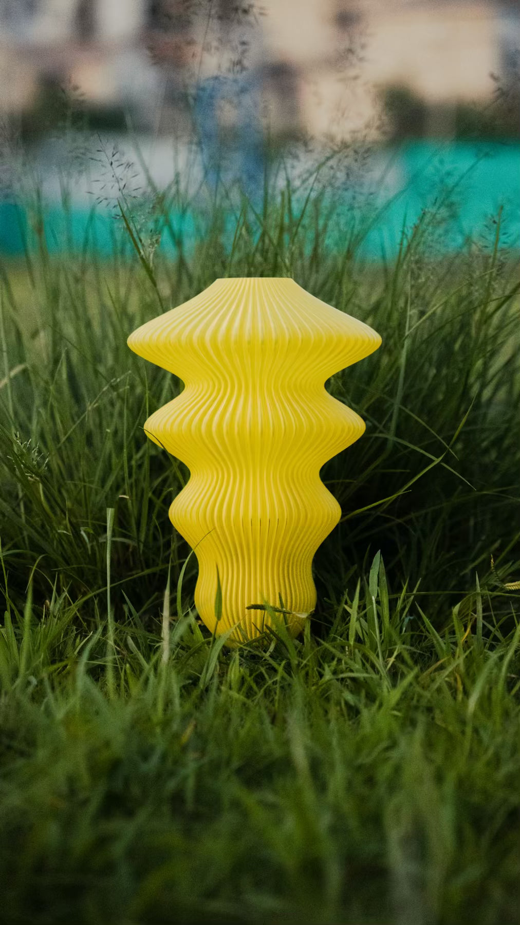 Muvèlo Ruvaa Max Yellow portable rechargeable table lamp with a sculptural ribbed form.
