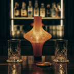 Decorative lamp on a bar counter with bottles in the background