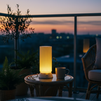 Lamp and mug on a table with a scenic view at dusk