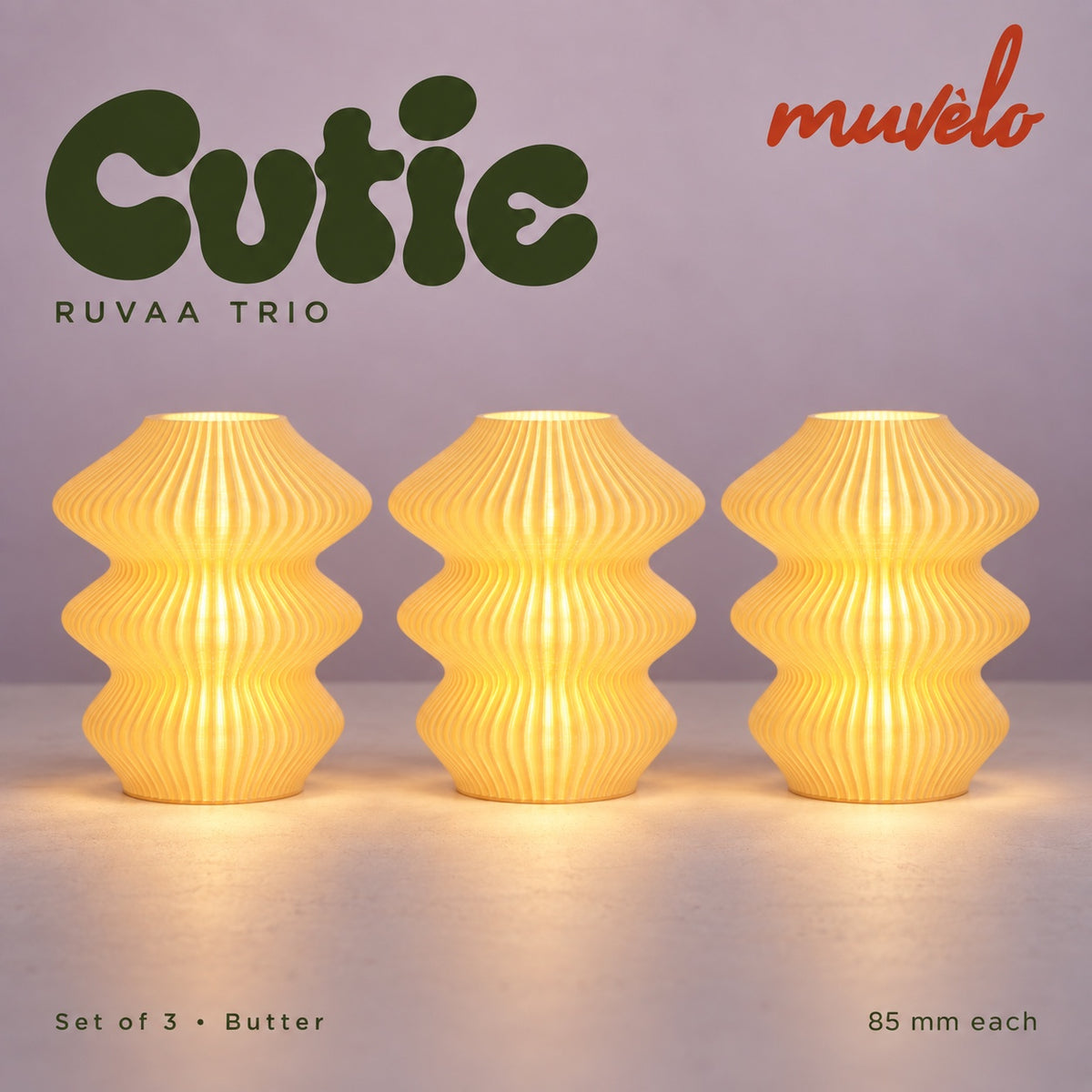 Muvèlo Cutie set of three in Butter: Ruvaa, Ruvaa, Ruvaa, all illuminated and shown together.