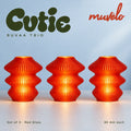 Muvèlo Cutie set of three in Red Glass: Ruvaa, Ruvaa, Ruvaa, all illuminated and shown together.