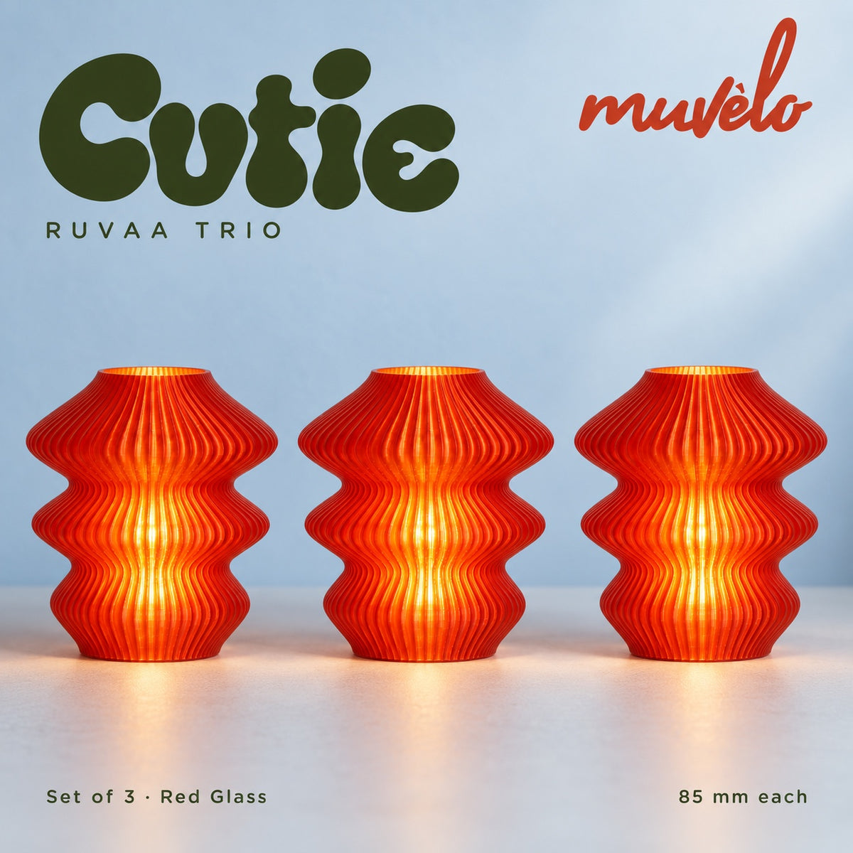 Muvèlo Cutie set of three in Red Glass: Ruvaa, Ruvaa, Ruvaa, all illuminated and shown together.