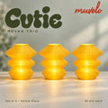 Muvèlo Cutie set of three in Yellow Glass: Ruvaa, Ruvaa, Ruvaa, all illuminated and shown together.