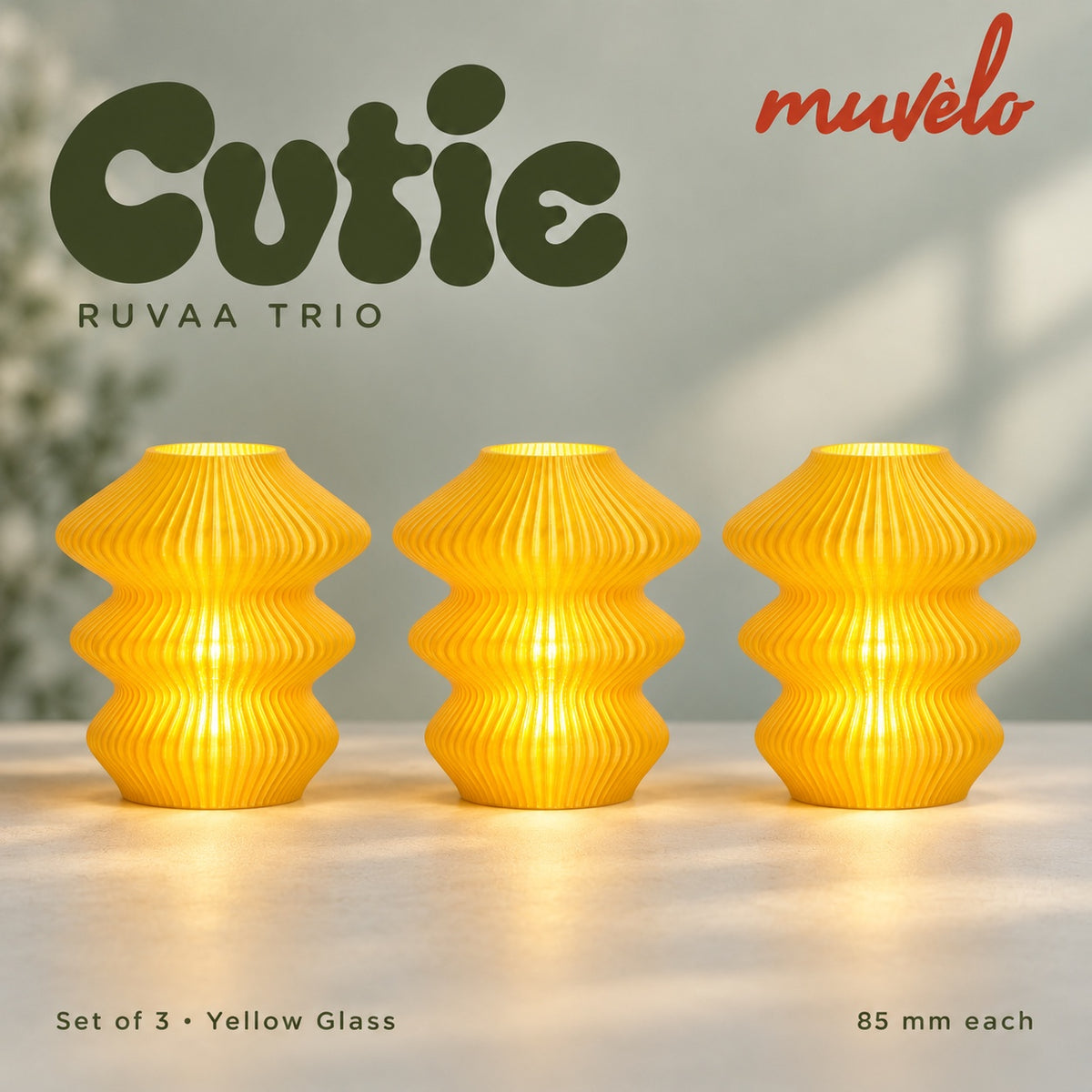 Muvèlo Cutie set of three in Yellow Glass: Ruvaa, Ruvaa, Ruvaa, all illuminated and shown together.