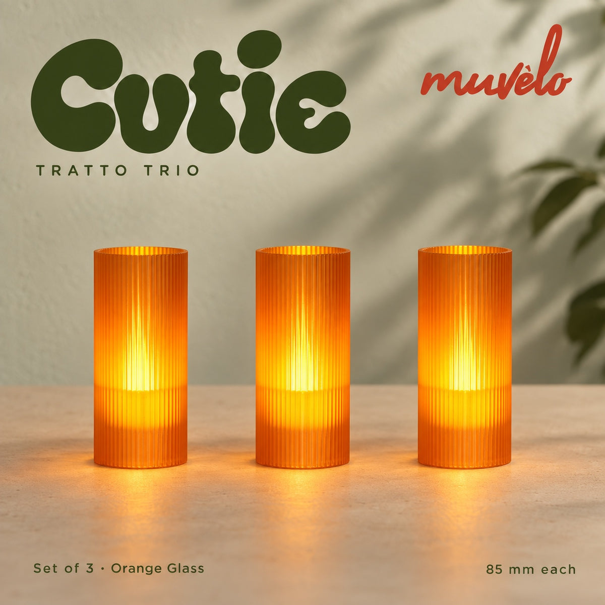 Muvèlo Cutie set of three in Orange Glass: Tratto, Tratto, Tratto, all illuminated and shown together.