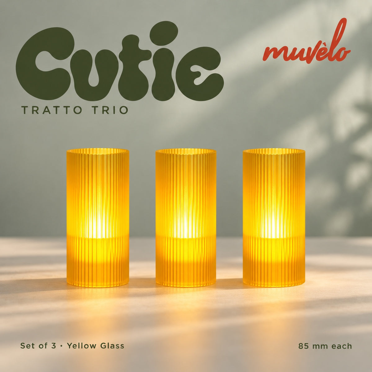 Muvèlo Cutie set of three in Yellow Glass: Tratto, Tratto, Tratto, all illuminated and shown together.