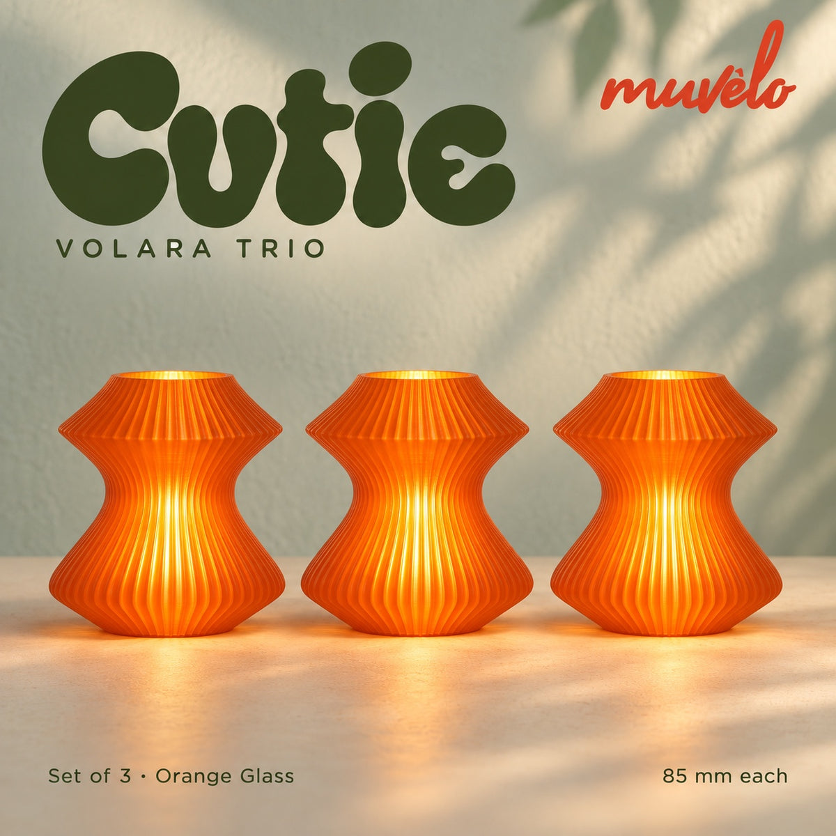 Muvèlo Cutie set of three in Orange Glass: Volara, Volara, Volara, all illuminated and shown together.