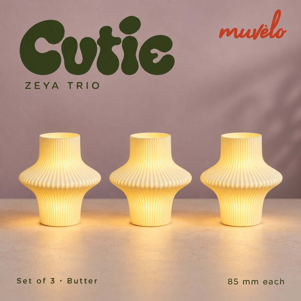 Muvèlo Cutie set of three in Butter: Zeya, Zeya, Zeya, all illuminated and shown together.