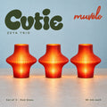 Muvèlo Cutie set of three in Red Glass: Zeya, Zeya, Zeya, all illuminated and shown together.