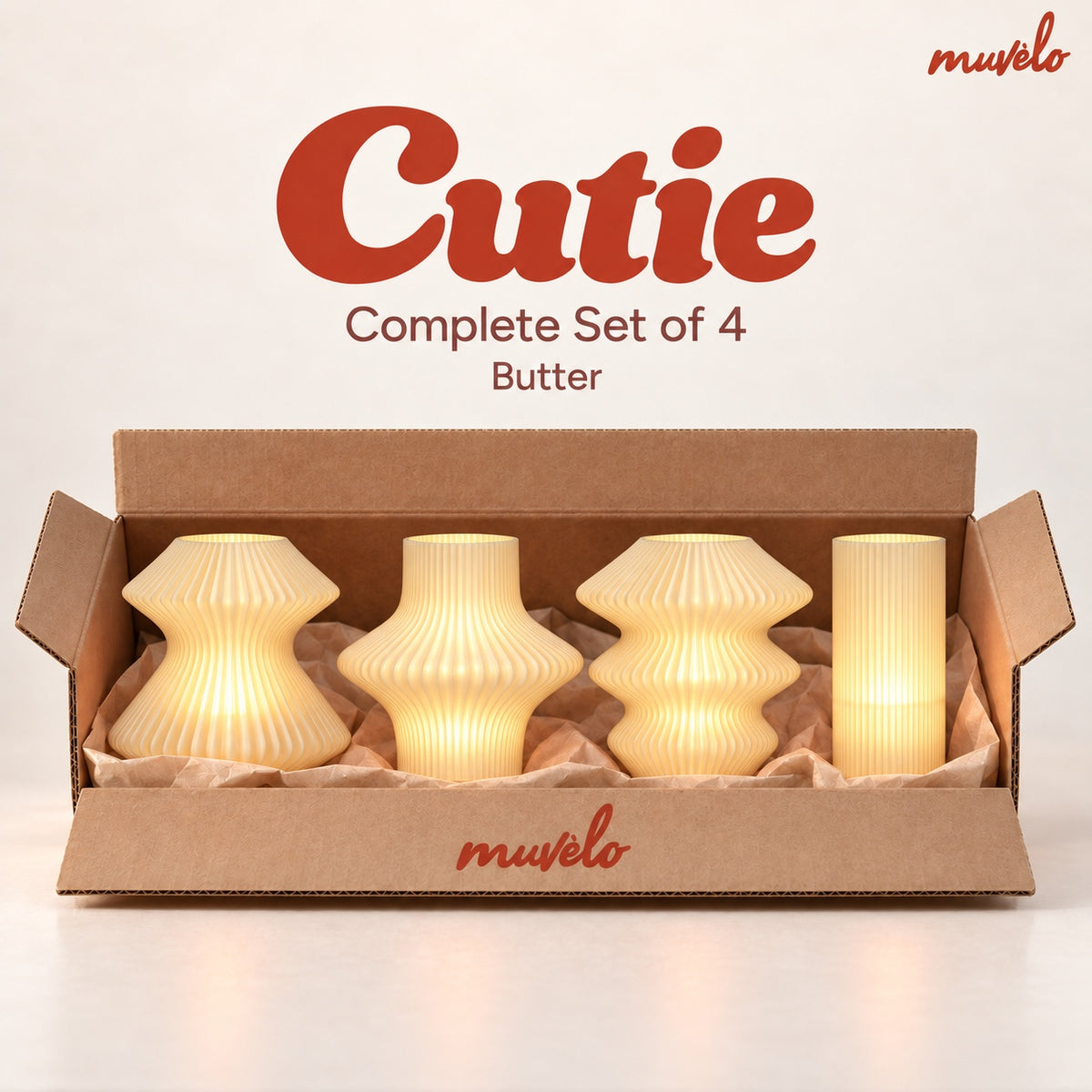 All four Cutie mini lamps in Butter, shown together in their box.