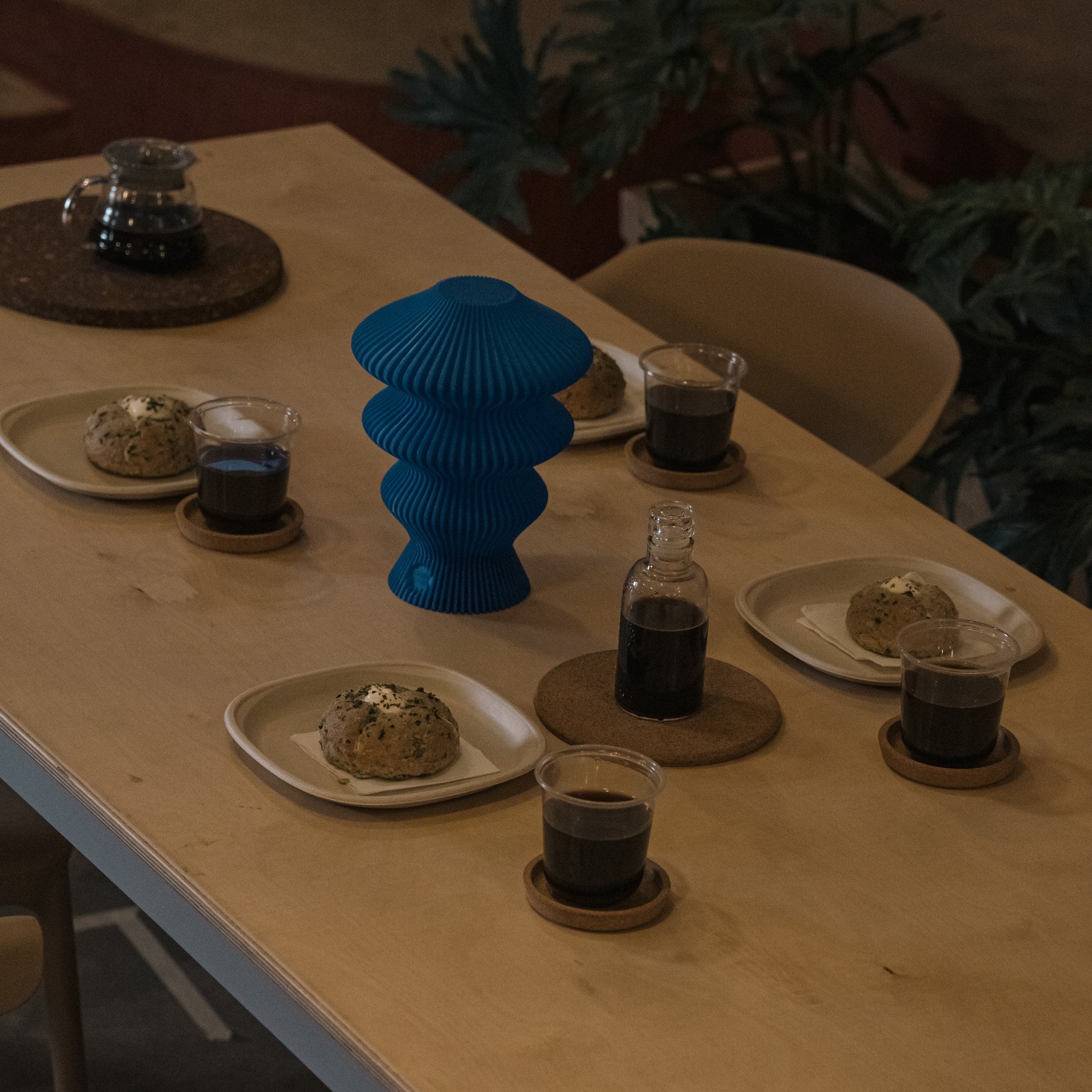 Blue Ruvaa Mono portable table lamp switched off on a dining table
