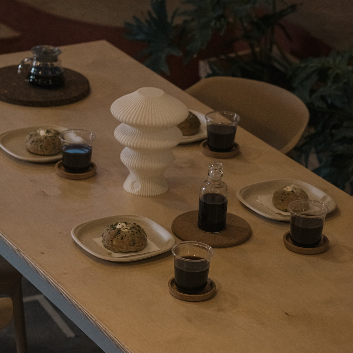 White Ruvaa Mono portable table lamp switched off on a dining table