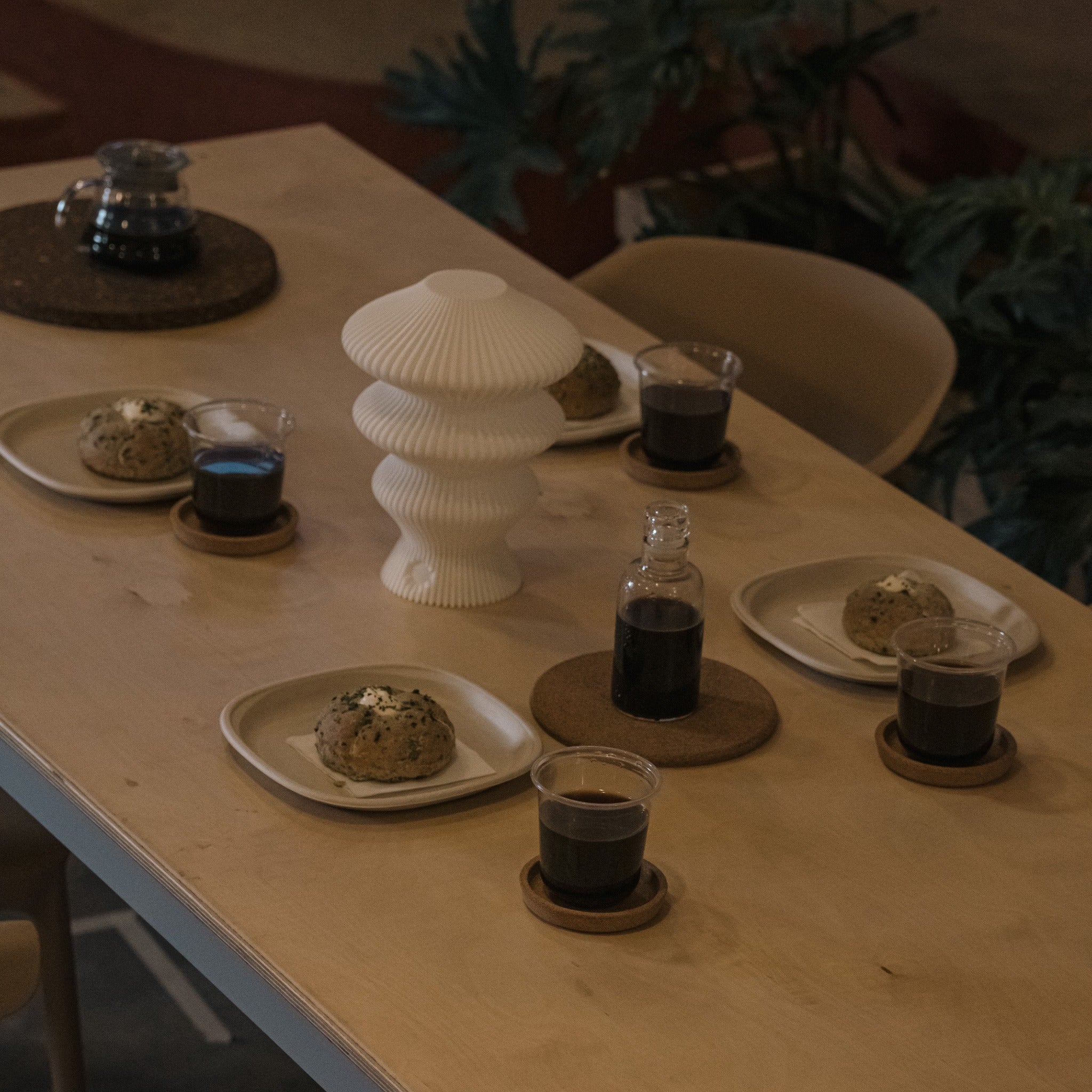 White Ruvaa Mono portable table lamp switched off on a dining table