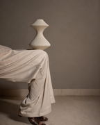 volara Max Vanilla button control rechargeable table lamp switched off in a neutral editorial setting